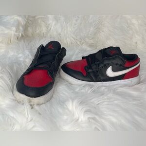 Kids Jordan/Nike Black and Red Sneakers with White Swoosh